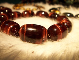 Showing a bracelet in the context of red tiger's eye meaning